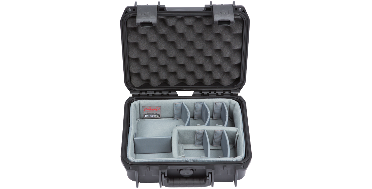 Interior of iSeries 1209-4 case with padded dividers and egg-crate foam, ideal for organizing photo, pistol, or fishing accessories.