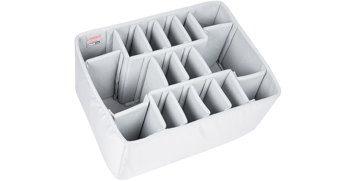 Angled view of Think Tank iSeries Divider Set featuring adjustable foam inserts. Durable and protective solution for organizing household or camera gear.