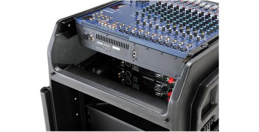 Close-up of SKB Gig Rig case top section showing mounted audio mixer and rear access to power connections for efficient gear management.