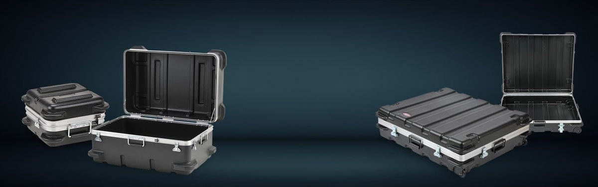 Set of black hard-shell cases on a dark blue background