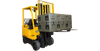 3R Forklift Riser Kit installed on 3R Series case lifted by yellow forklift for easy transport and access.