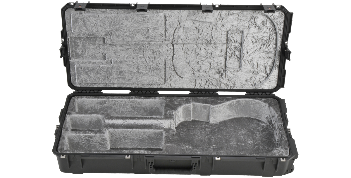 Interior view of iSeries Guitar Case with neck cradle and accessory compartments, designed for acoustic guitar travel protection.