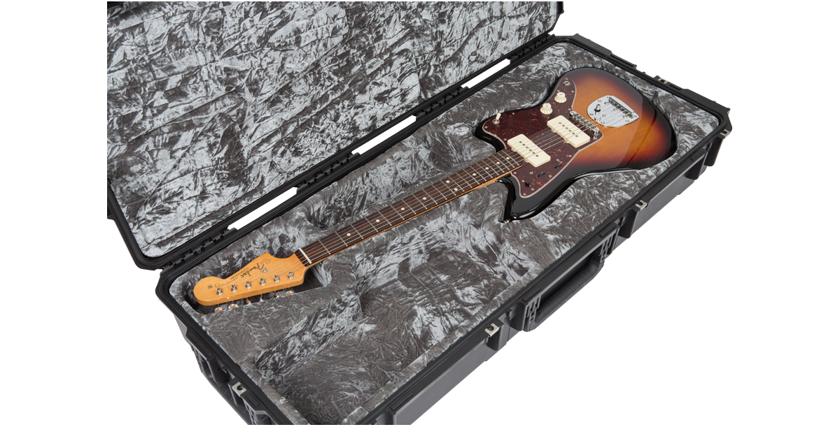 Open Waterproof Guitar Case for Jaguar Jazzmaster showing full-length sunburst guitar in custom-fit grey foam interior with TSA locks.