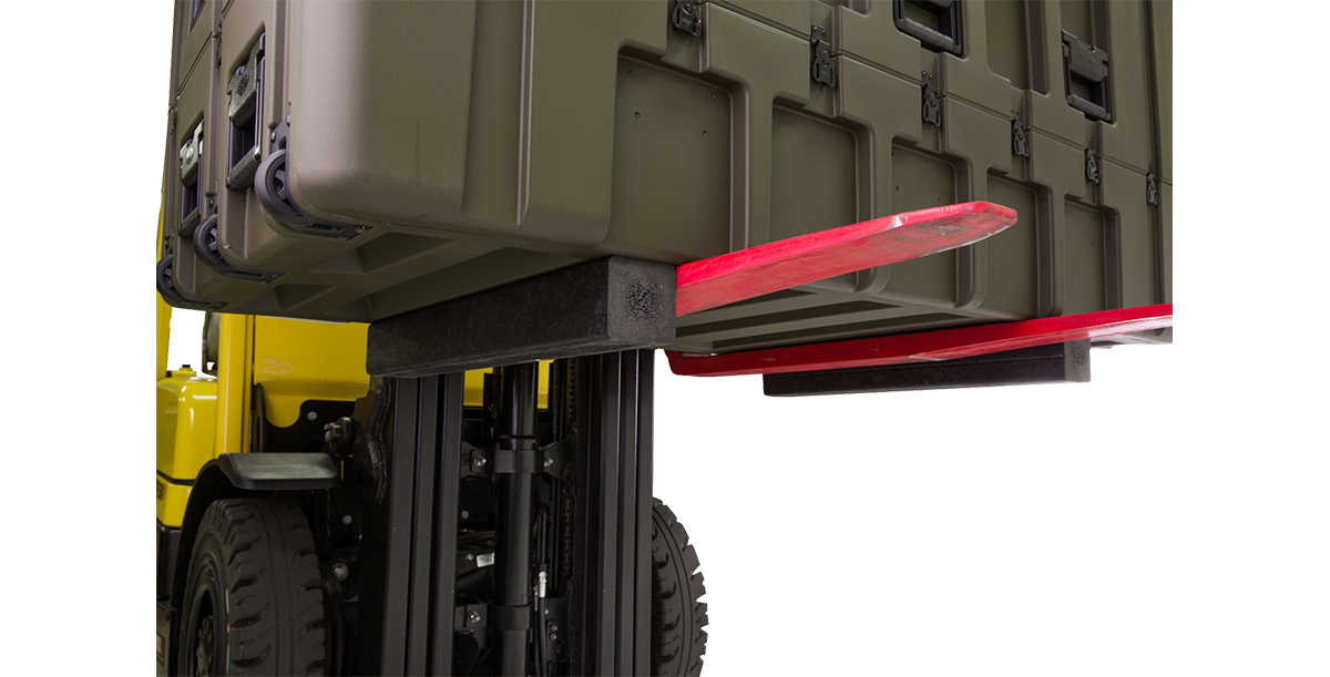Heavy-duty rSeries Forklift Runners in use with forklift lifting a case, demonstrating enhanced access and support during transport.