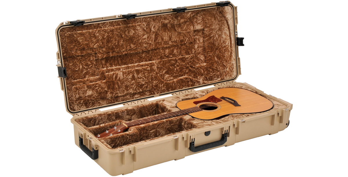 SKB tan waterproof acoustic guitar case open with guitar inside, plush brown interior and molded fit for maximum travel protection.