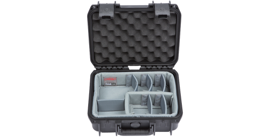 Interior of iSeries 1209-4 case with padded dividers and egg-crate foam, ideal for organizing photo, pistol, or fishing accessories.