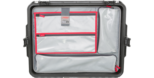 iSeries 2217 Lid Organizer - SKB iSeries lid organizer securely mounted inside case lid with clear mesh pockets and red zippers for compact storage.