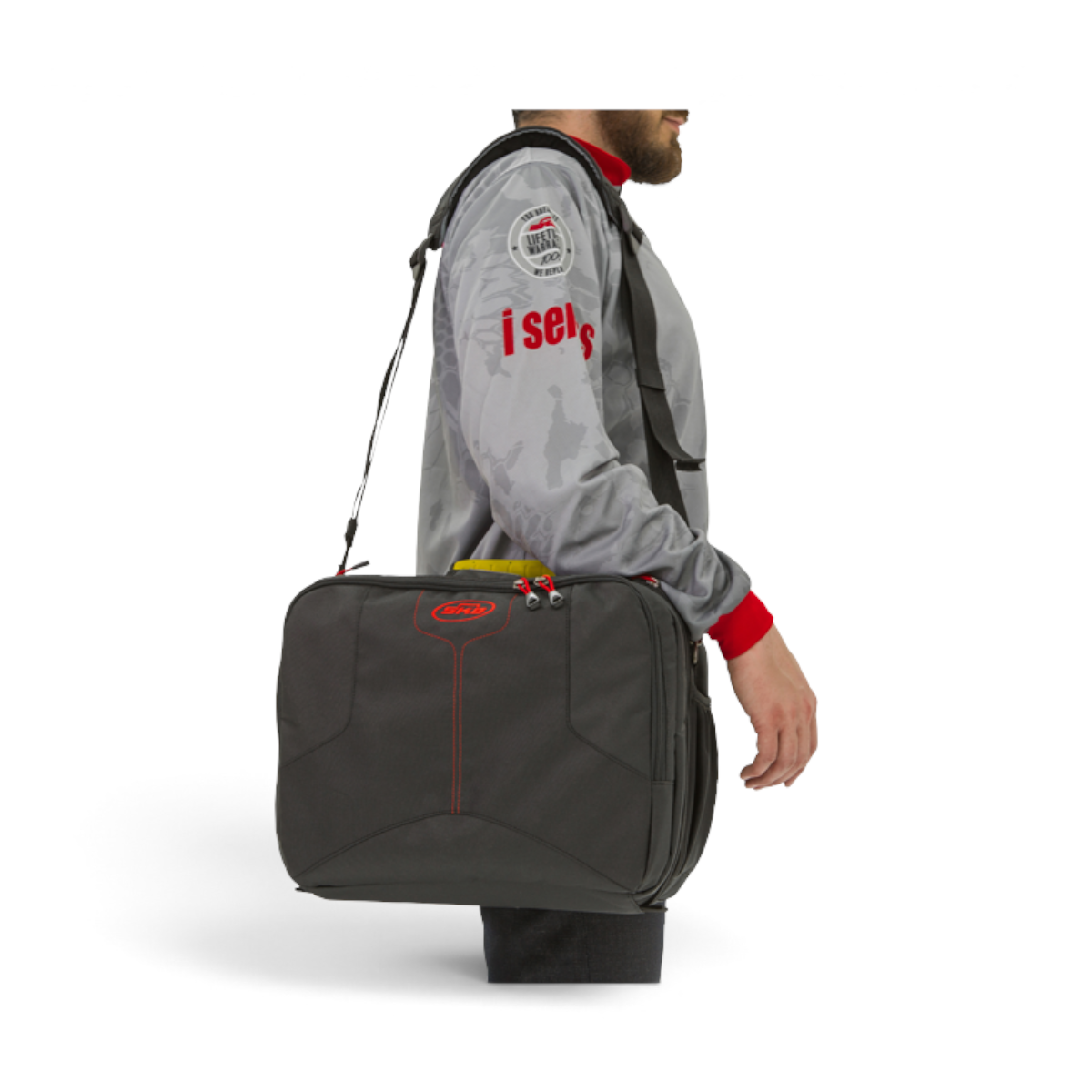 SKB Cases iSeries 1309-6 large black lure case with shoulder strap worn by a person in a grey jacket