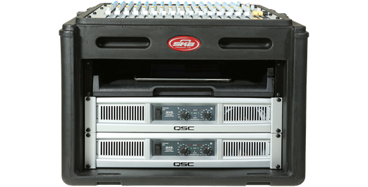 10 x 6 Compact Rig rack case with steel rails and TSA locks, loaded with QSC amplifiers and mixer for secure pro-audio transport.