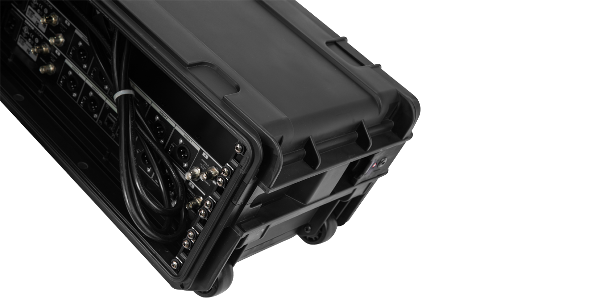 Rear cable management view of Compact Rack with Wheels, displaying connected pro-audio gear and organized wiring.