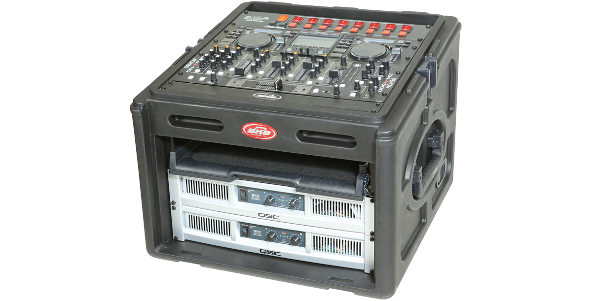Compact Rack Case with steel rails and TSA locks, shown with DJ controller and QSC amplifiers for portable audio rig use.