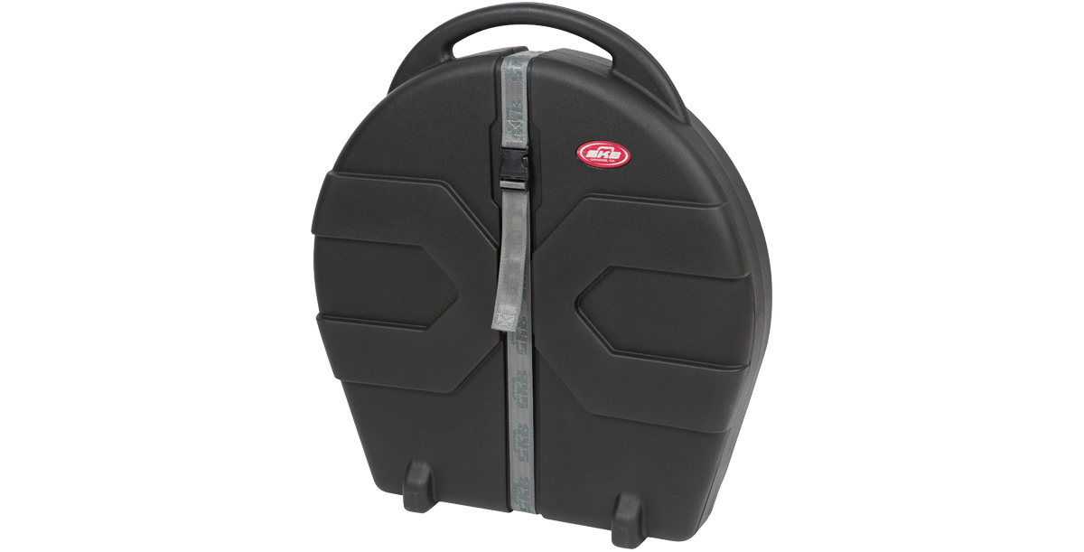 Angled view of Rolling Cymbal Vault showing compact, cylindrical design with secure strap and molded handle for portability.