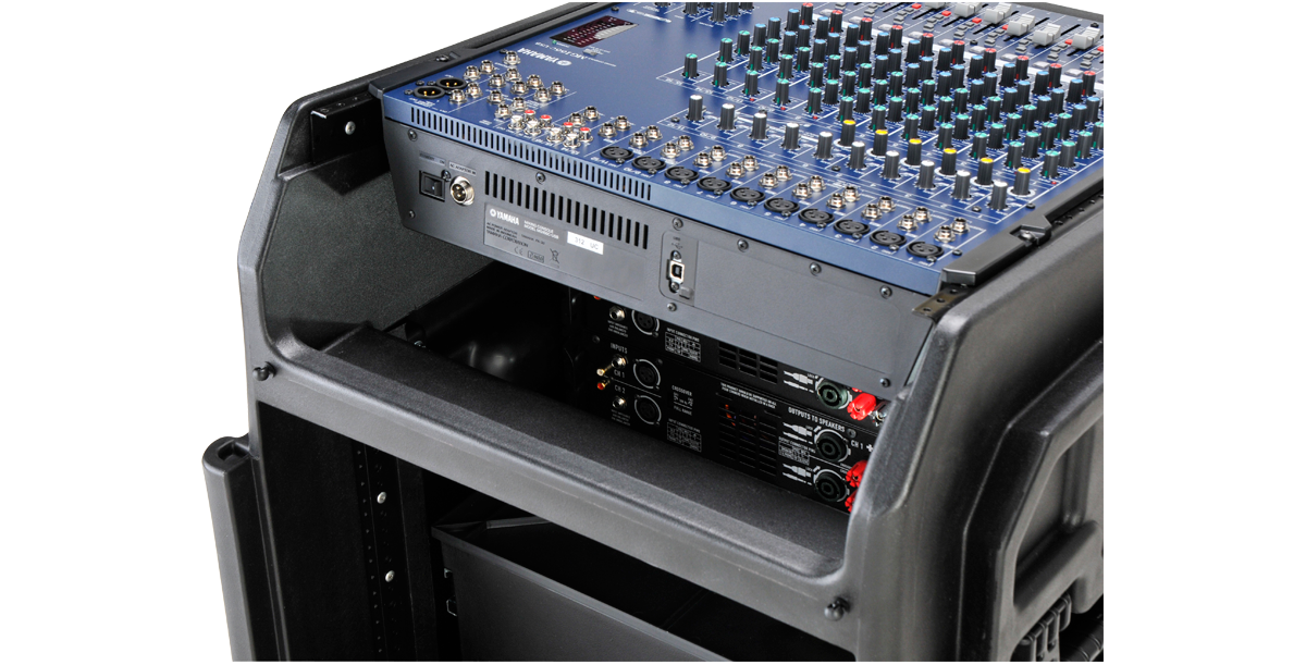 Close-up of SKB Gig Rig case top section showing mounted audio mixer and rear access to power connections for efficient gear management.
