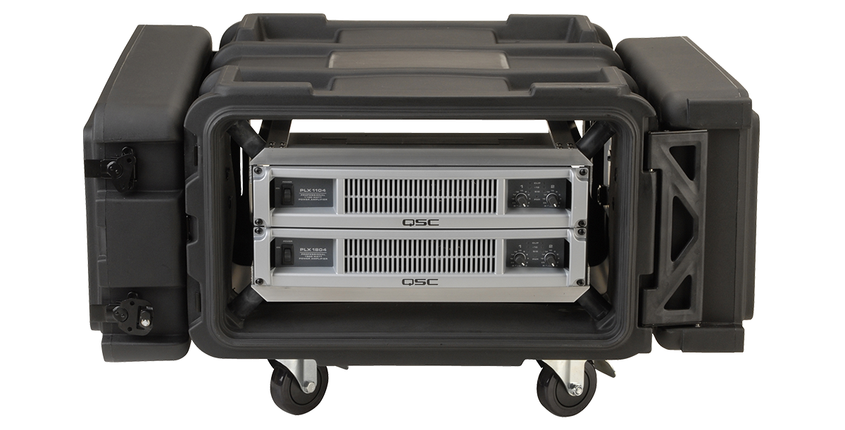 Deep shock rack with 24 inch depth and vibration mitigation, shown with mounted QSC rackmount amplifiers and durable rolling case.