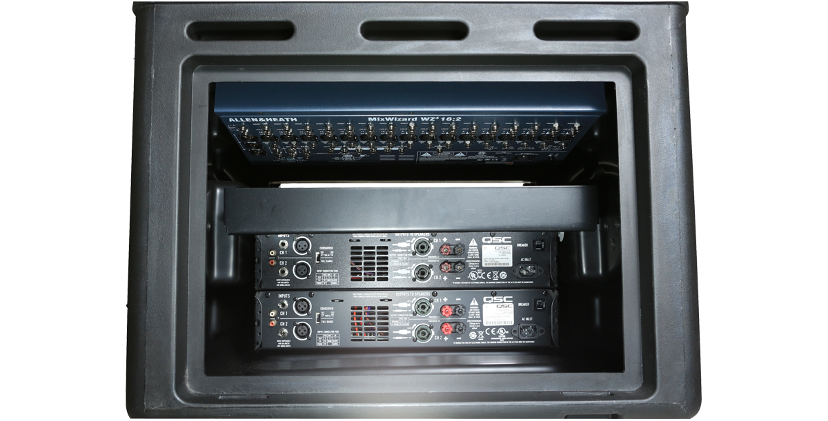 Rear view of 10 x 6 Compact Rack Case showing mounted QSC amplifier connections and internal steel rail structure.