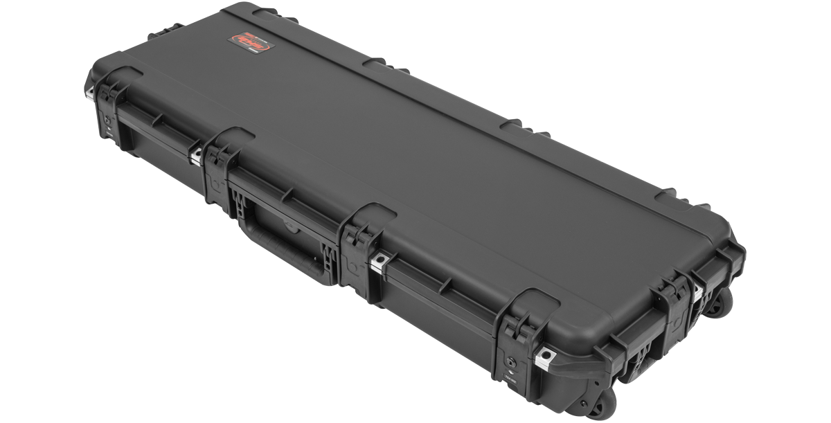 Closed iSeries Waterproof PRS Guitar Case with rugged black exterior, TSA latches, and rolling wheels for travel convenience.