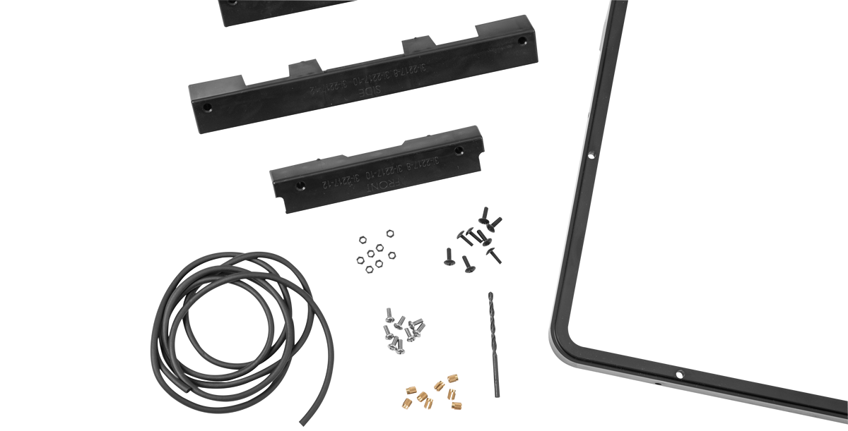 Close-up of iSeries 2217 Panel Mounting Kit components including gasket, screws, and drill jigs for flush panel mounting.