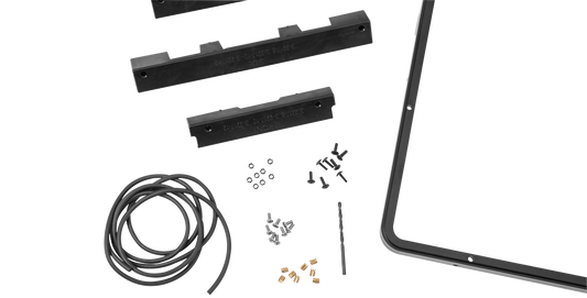 Close-up of iSeries 2217 Panel Mounting Kit components including gasket, screws, and drill jigs for flush panel mounting.