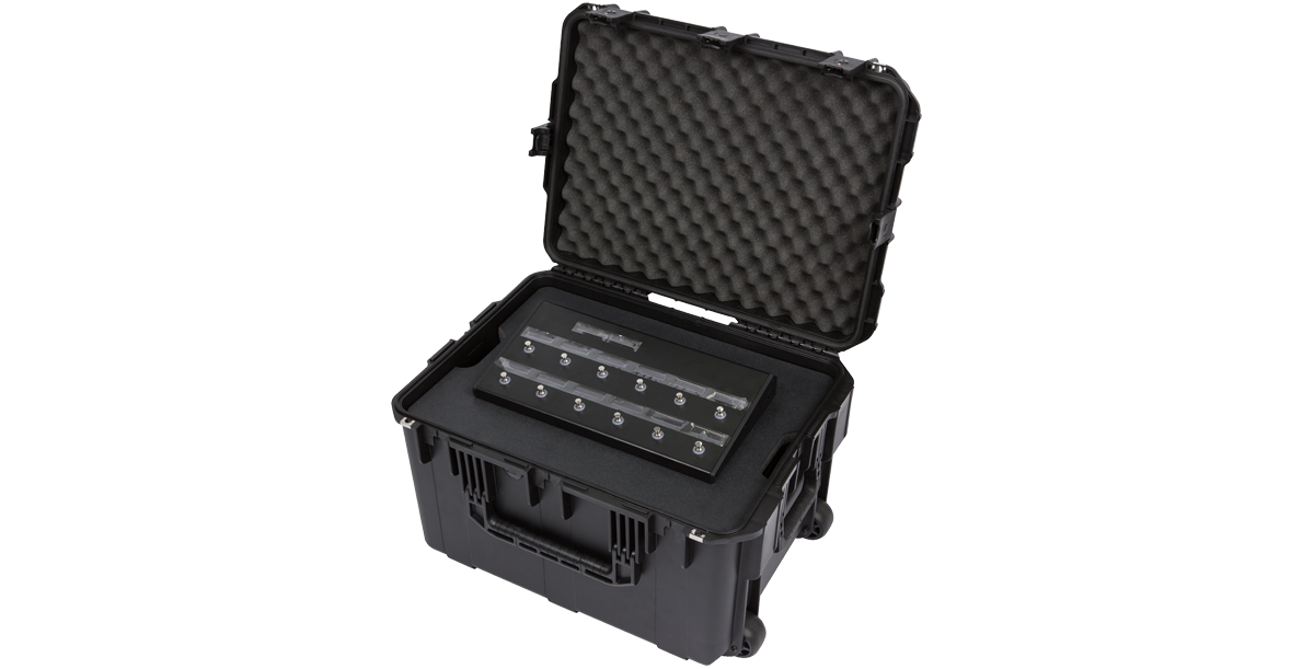 4U iSeries Guitar FX Rack with injection molded case and foam interior, securely holding a foot controller for easy transport.