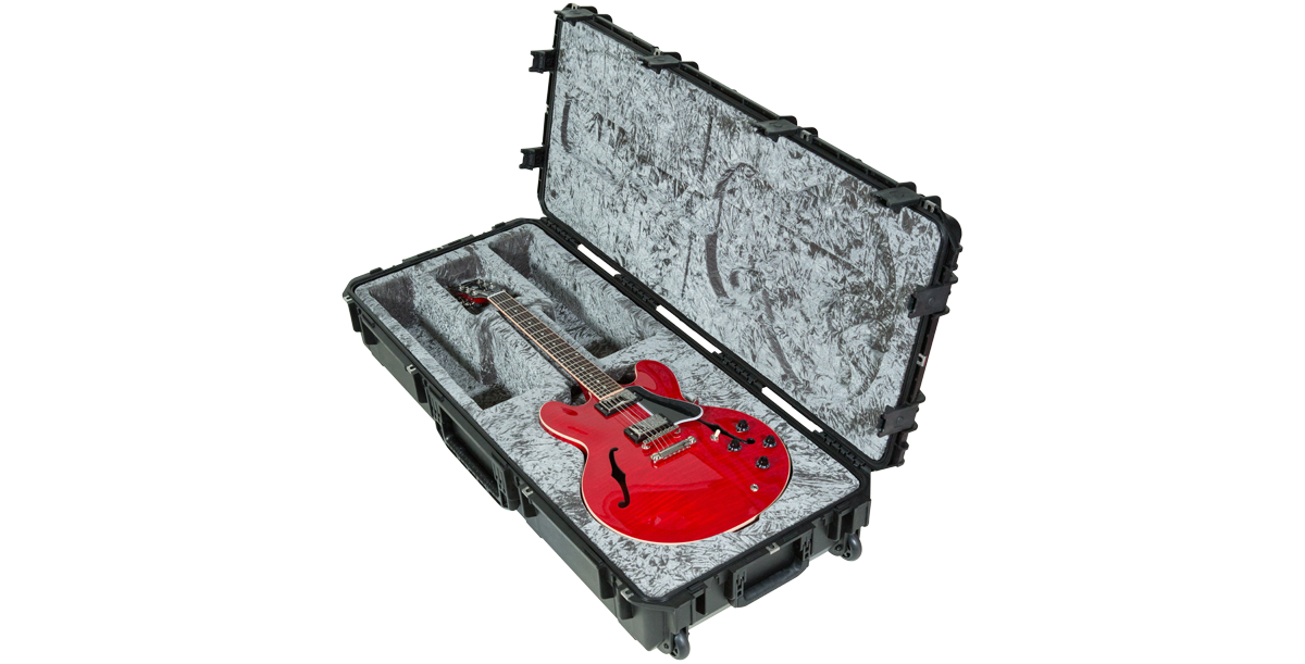 Angled view of iSeries 335 Guitar Case with red electric guitar, showcasing plush molded interior and durable waterproof shell.