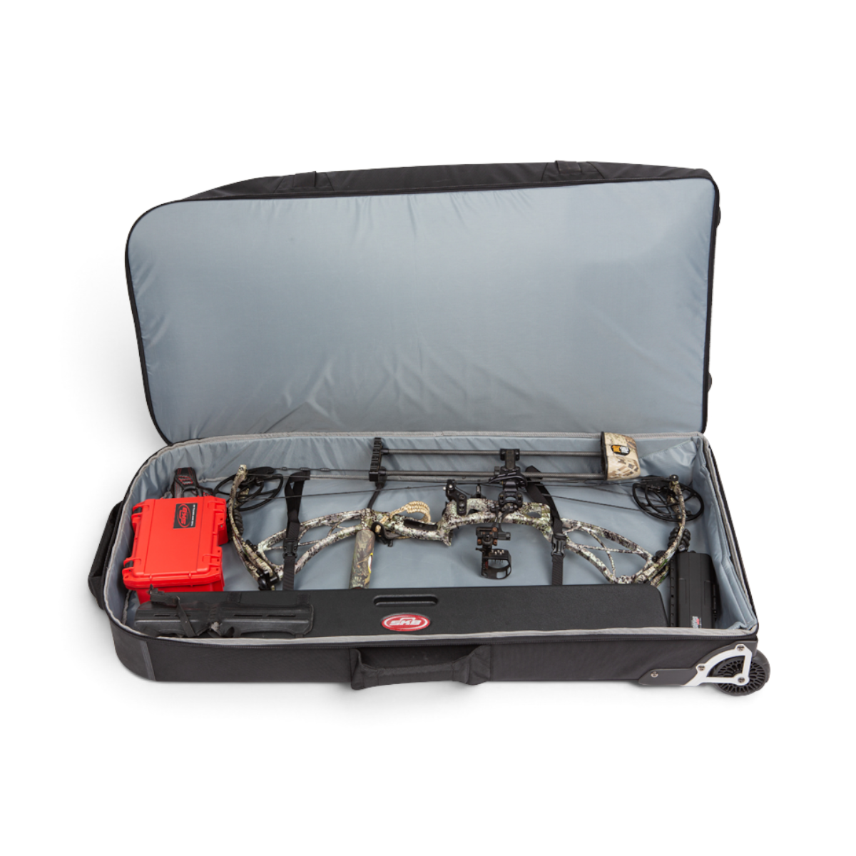 SKB Cases Bow Traveler case open with a camo compound bow and red accessory box inside on a grey padded interior
