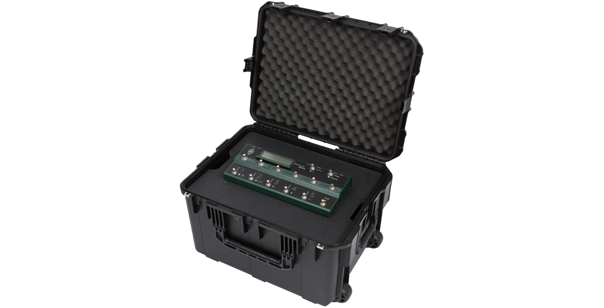 Angled open view of 4U iSeries Guitar FX Fly Rack with foot controller securely fitted in foam-lined molded case.