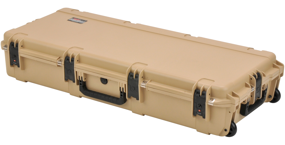 Closed SKB waterproof acoustic guitar case in tan, TSA-approved with secure latches and wheels for easy transport and flight readiness.