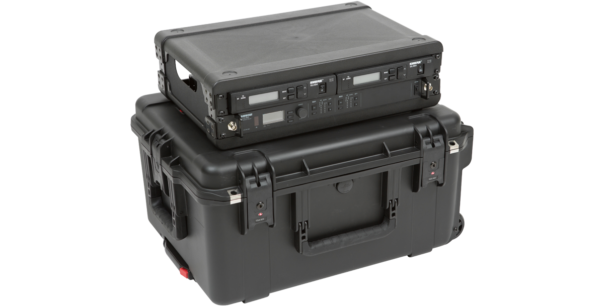 Rear angled view of 2U Wireless Mic Fly Rack mounted on black rolling case, built for professional wireless mic transport.