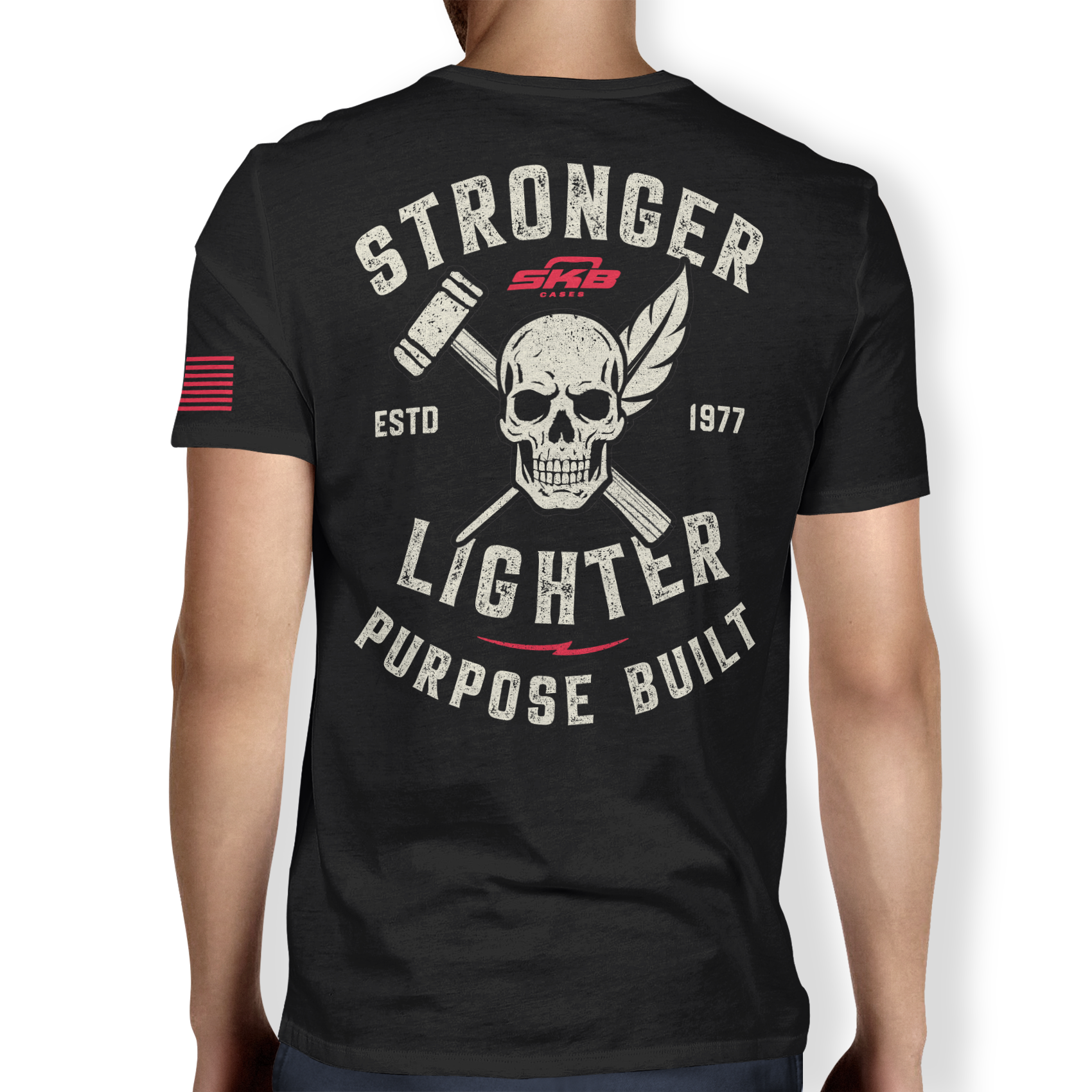 Back view of black performance t-shirt featuring bold skull and crossed tools graphic with 'Stronger Lighter Purpose Built' slogan. Est. 1977 design.