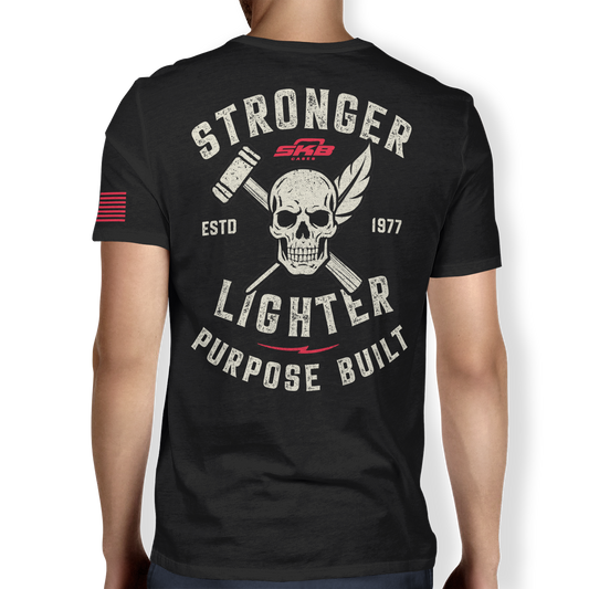 Back view of black performance t-shirt featuring bold skull and crossed tools graphic with 'Stronger Lighter Purpose Built' slogan. Est. 1977 design.
