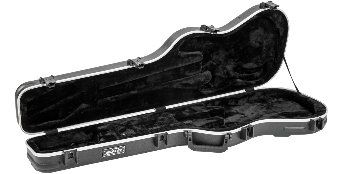Interior of Precision Jazz Bass Case - TSA Lock Protection empty, showcasing plush black lining and molded compartments for secure bass fit.