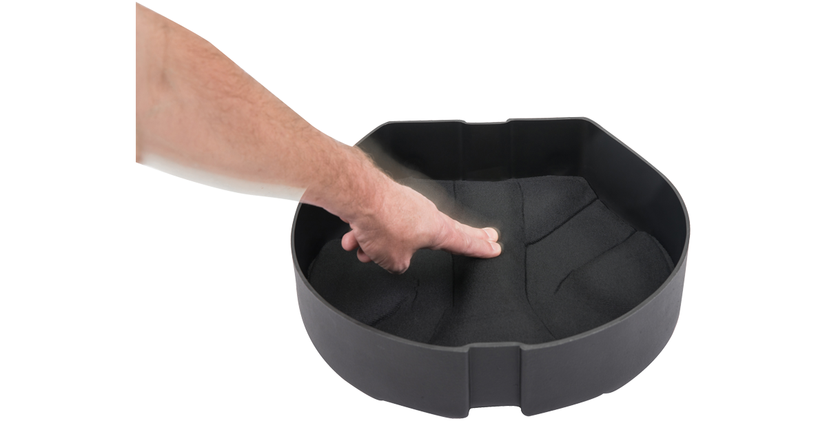 SKB Drum Package - Ultimate Drum Case Set showing hand pressing into foam padding, demonstrating soft yet firm protective interior.