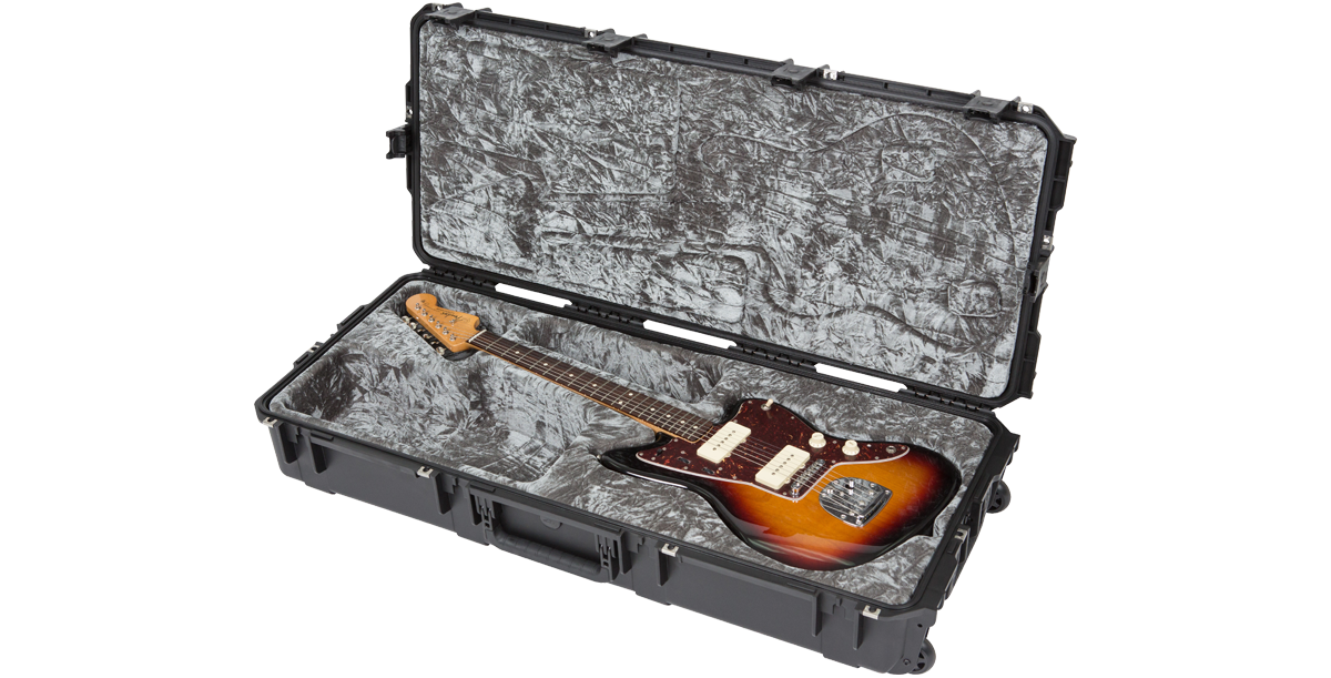 Angled view of sunburst Jazzmaster guitar in waterproof SKB case, highlighting durable shell and precision-fit interior for safe storage.