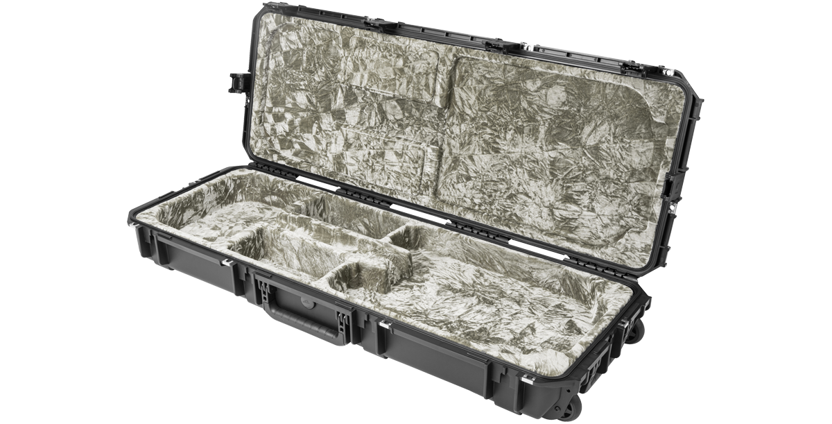 Angled view of open waterproof electric guitar case with soft interior lining and multiple compartments for secure instrument storage.