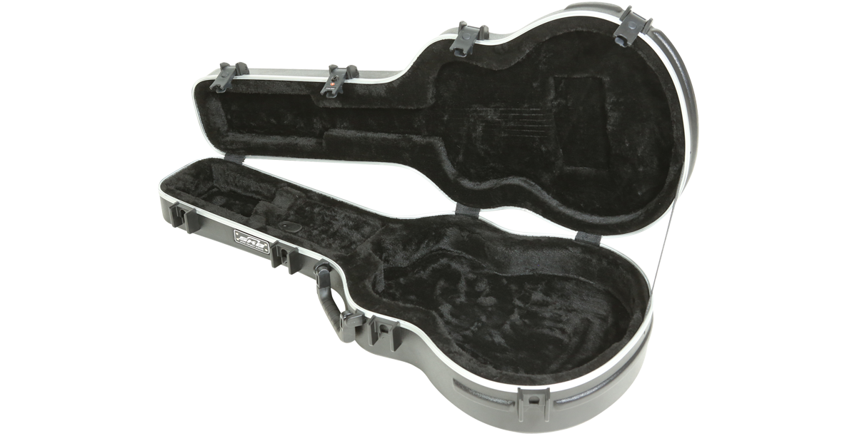 Interior view of Taylor GS Mini Acoustic Case, showcasing custom-molded fit and soft black lining for optimal guitar protection.
