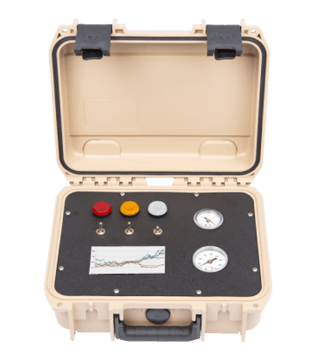 Portable testing device with buttons and gauges in a beige case on a white background