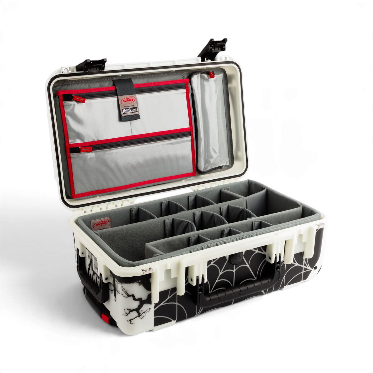 SKB Cases Glow in the Dark protective camera case with spiderweb pattern, open interior with padded dividers.