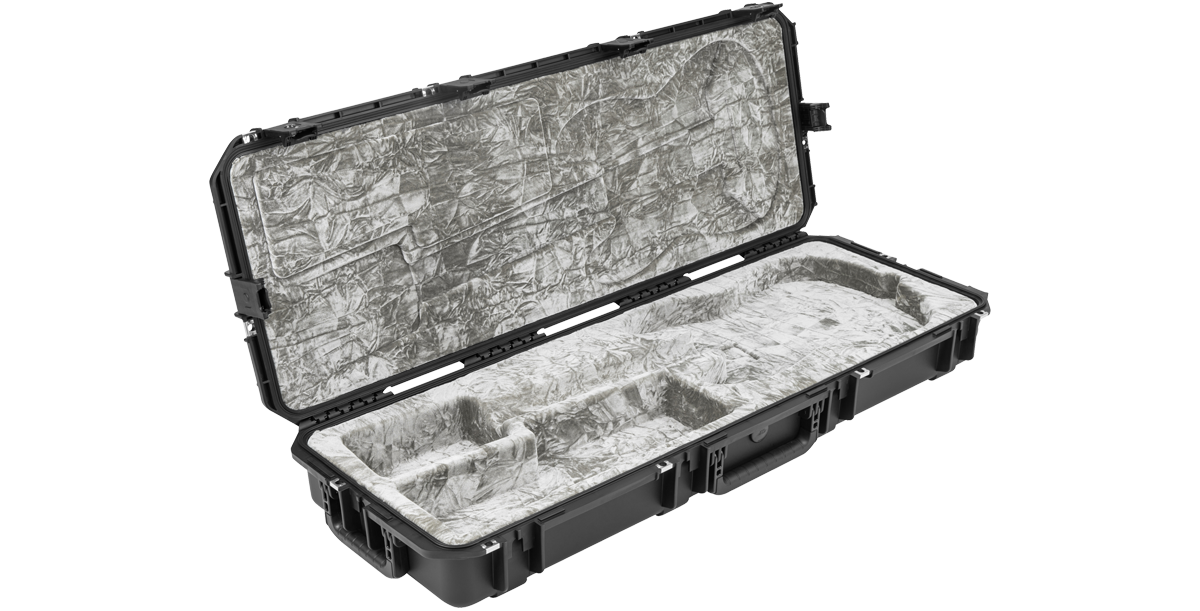 Angled view of open iSeries Stratocaster guitar case with grey plush lining and molded body shape for secure fit.
