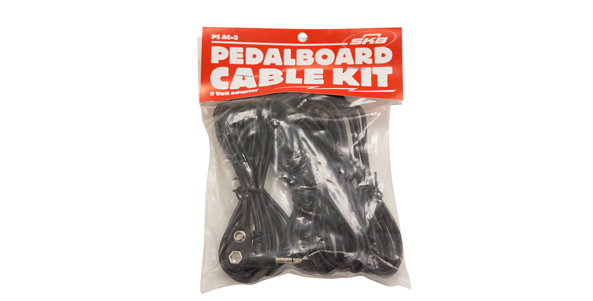 9V Pedalboard Adapter Cable Kit in retail packaging with multiple black cables for efficient pedalboard connections.