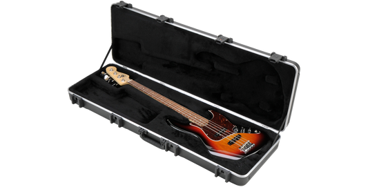 Electric Bass Case - SKB with plush interior securely holding a Fender-style bass guitar; durable ABS shell and TSA-approved latches.