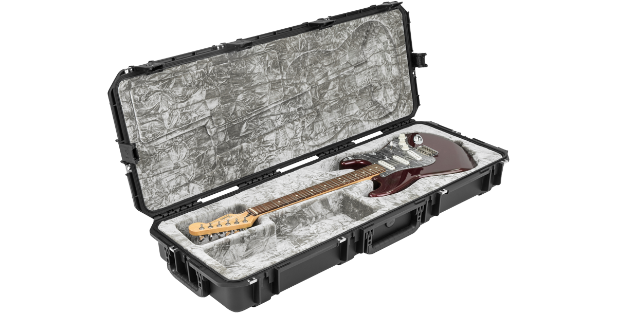 Stratocaster guitar inside waterproof iSeries case with plush grey interior, designed for maximum protection and fit.