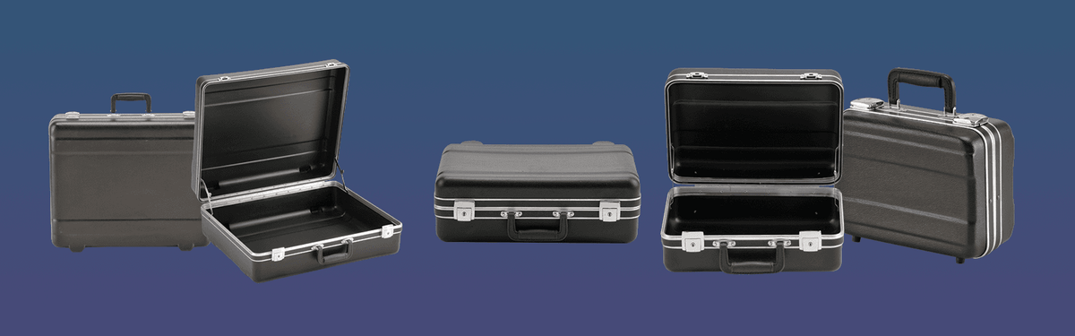 Set of black hard-shell cases on a blue background