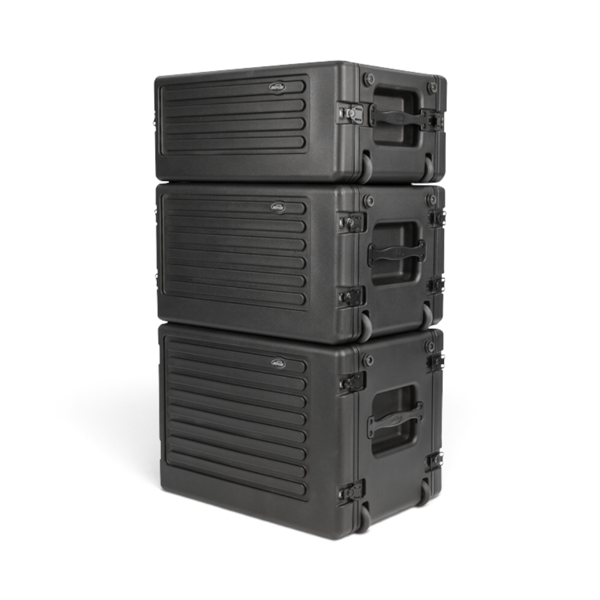Three stacked black SKB Cases rSeries shallow rolling racks with durable roto-molded polyethylene construction.
