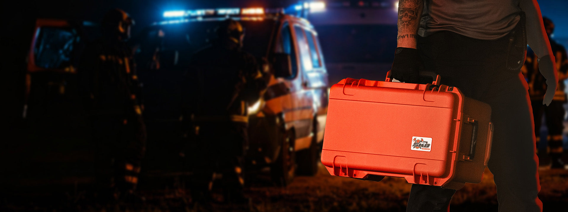 Orange hard-shell case on a dark background with emergency vehicles and people in the background