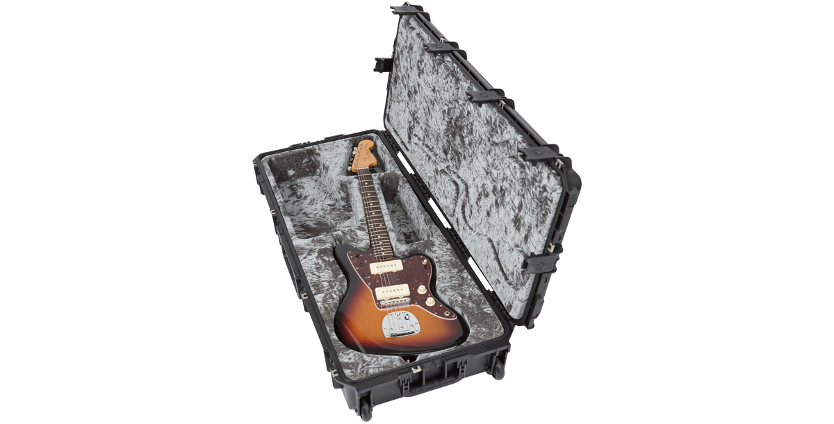 Jazzmaster guitar in SKB waterproof case, angled view showing plush interior and reinforced shell for premium instrument protection.