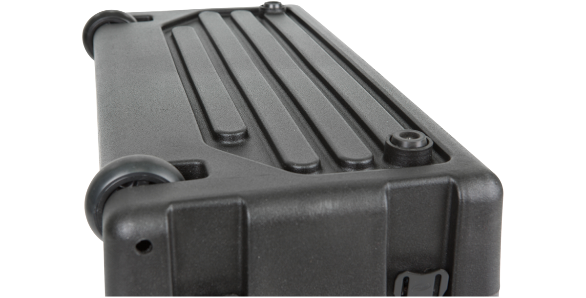 Close-up of the bottom of the SKB Roto Rolling Rack showing integrated wheels and reinforced corners for portability and protection.
