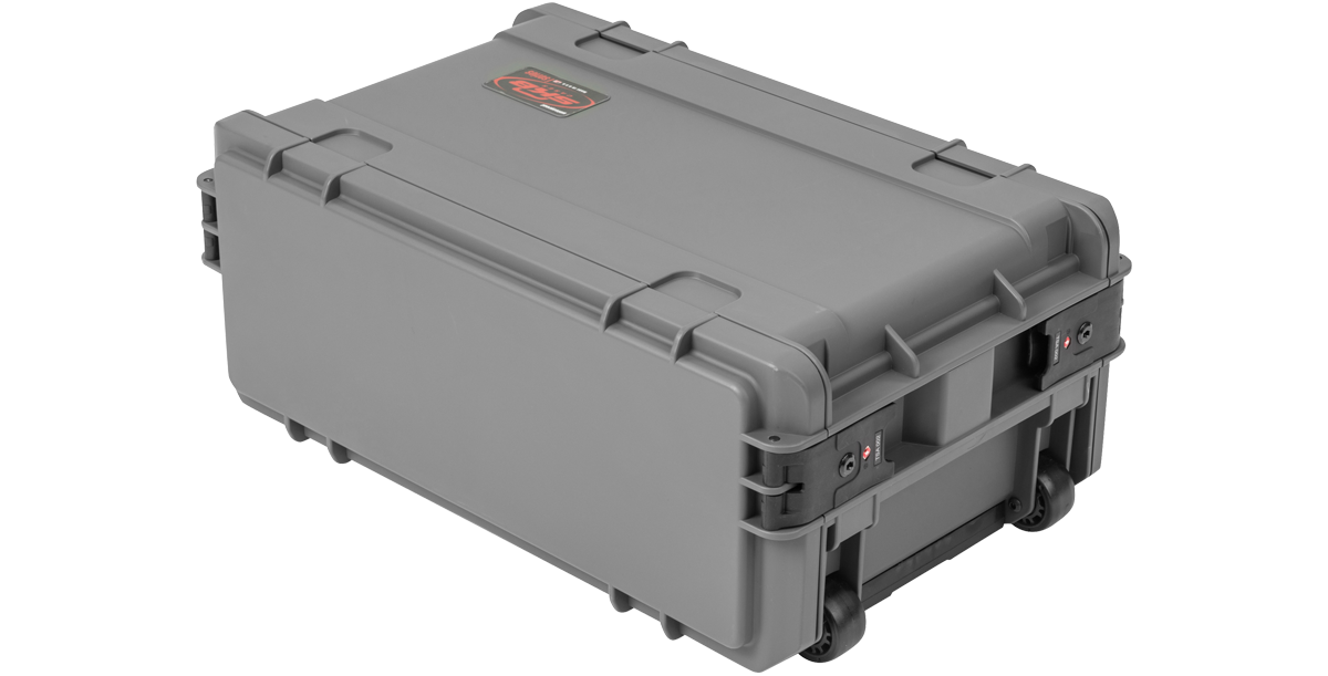 Compact molded rack with wheels shown in closed position, highlighting TSA latches and reinforced corners for secure and mobile equipment protection.