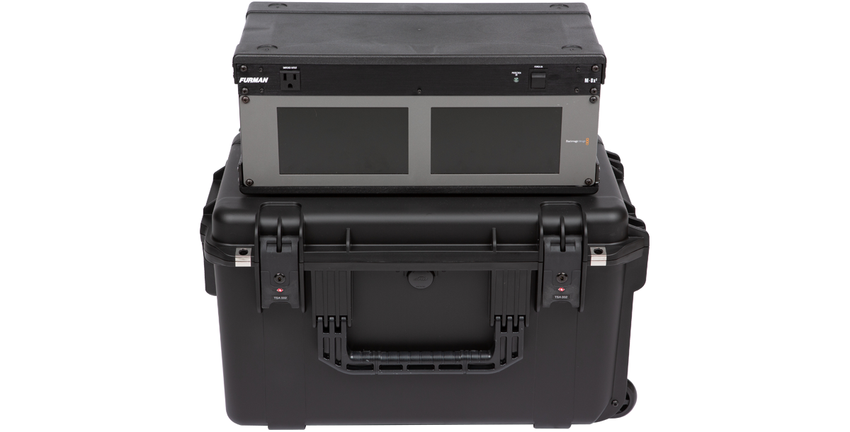 Rear view of 4U iSeries Fly Rack with rack unit placed on top, showing durable wheels and handle for easy transport.