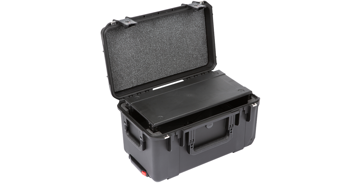 Injection Molded Fly Rack with partially inserted rack shelf, showcasing rugged design and reinforced corners for travel.