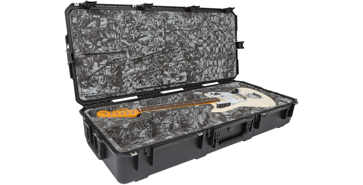 Waterproof guitar case for Jaguar Jazzmaster with white electric guitar inside, featuring molded interior and TSA locks for secure travel.